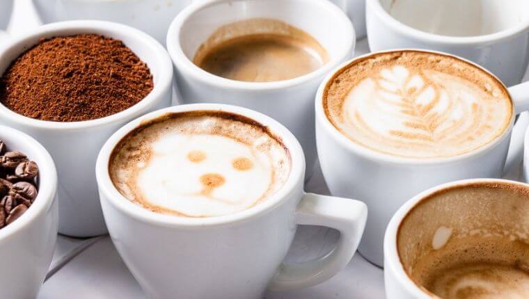 Many cups of different types of coffee (espresso, latte, cappuccino etc)