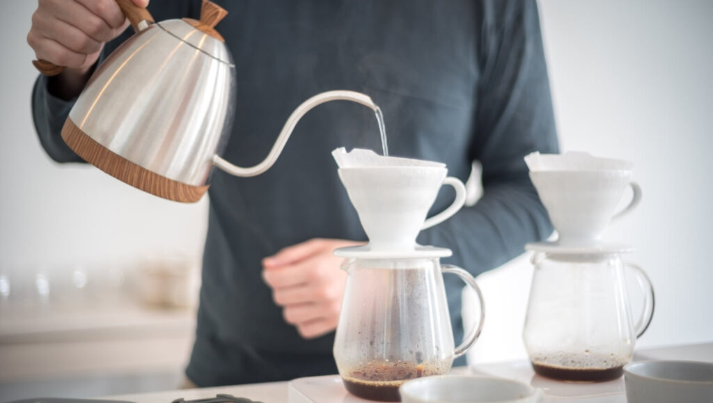 A man brewing a coffee with pour-over coffee method
