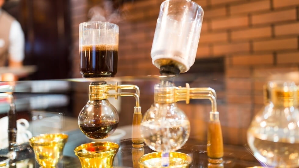 Siphon vacuum coffee maker standing on the bar