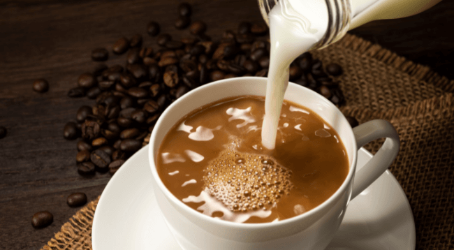 Pouring Milk in Coffee
