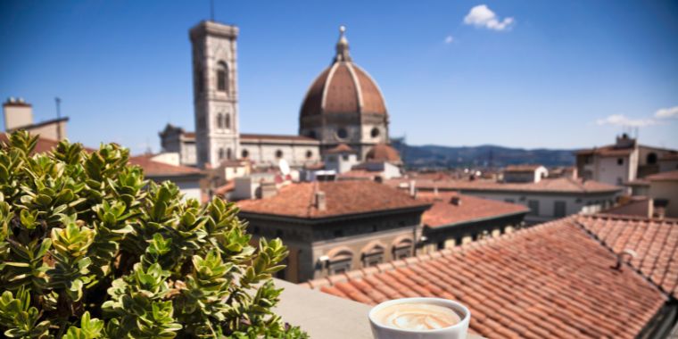 Florence cathedral in Italy view with a cup of freshly prepared Italian espresso